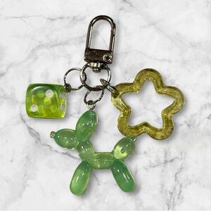 Green Keychain with Dice and Balloon Dog Charms